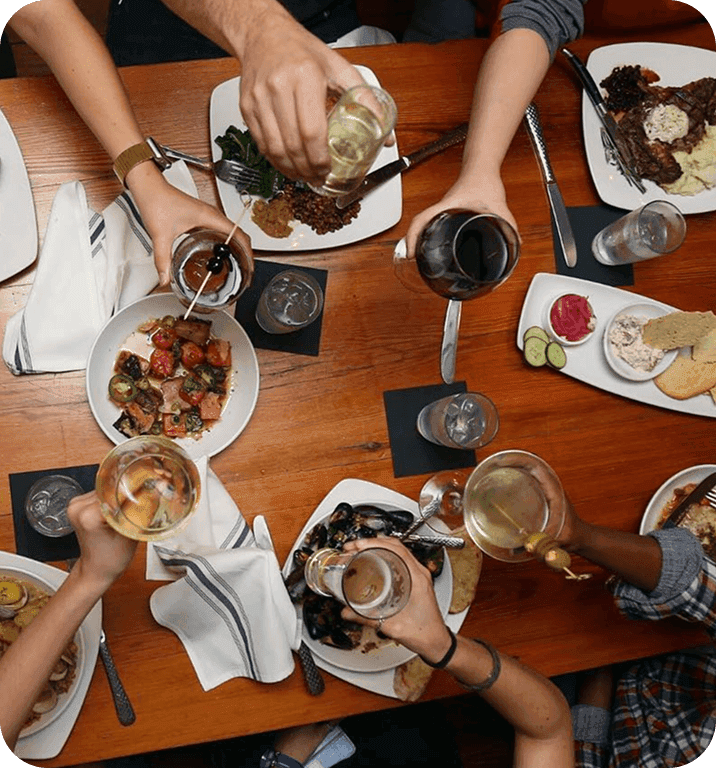 Guests enjoying food and drinks at 11th and Bay Southern Table