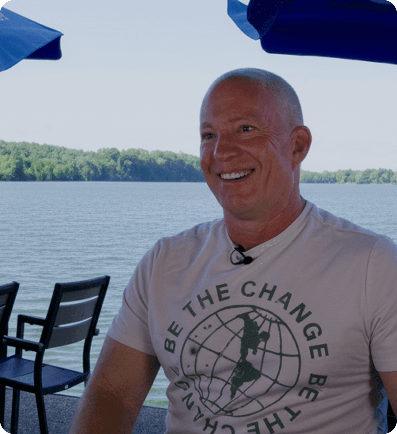 Man talking in front of a lake
