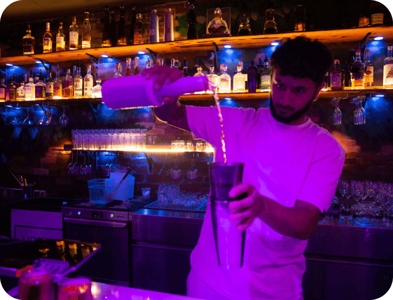 A bartender preparing a cocktail at Urban Roast