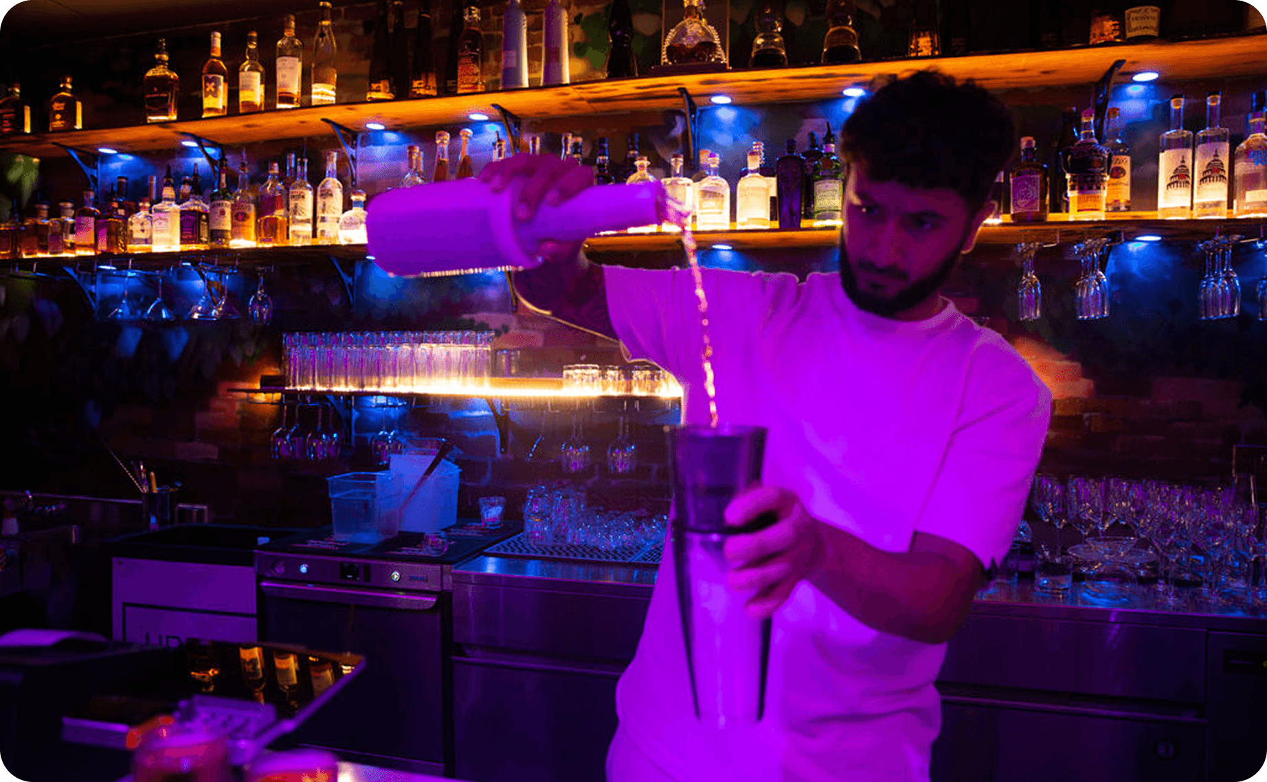 A bartender preparing a cocktail at Urban Roast