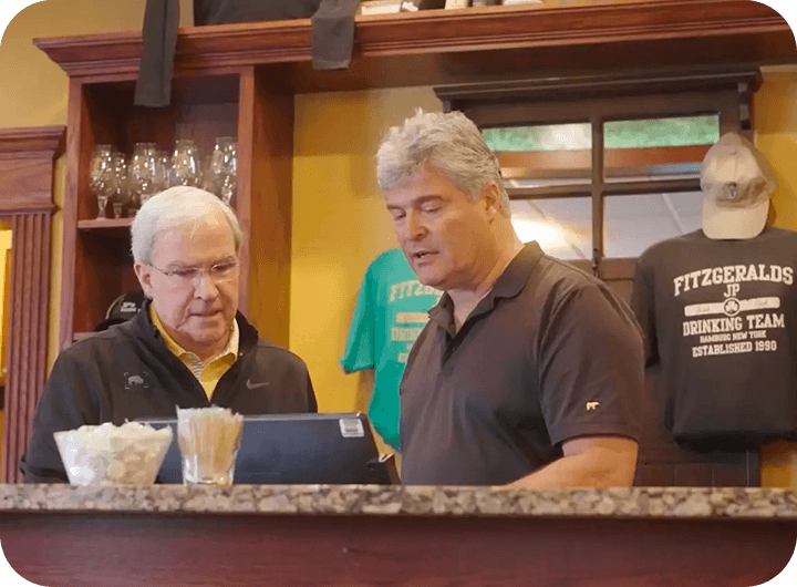 Bob Brunner, Owner of J.P. Fitzgerald’s, and Gary Keilich of Systems Technology Group at the POS counter