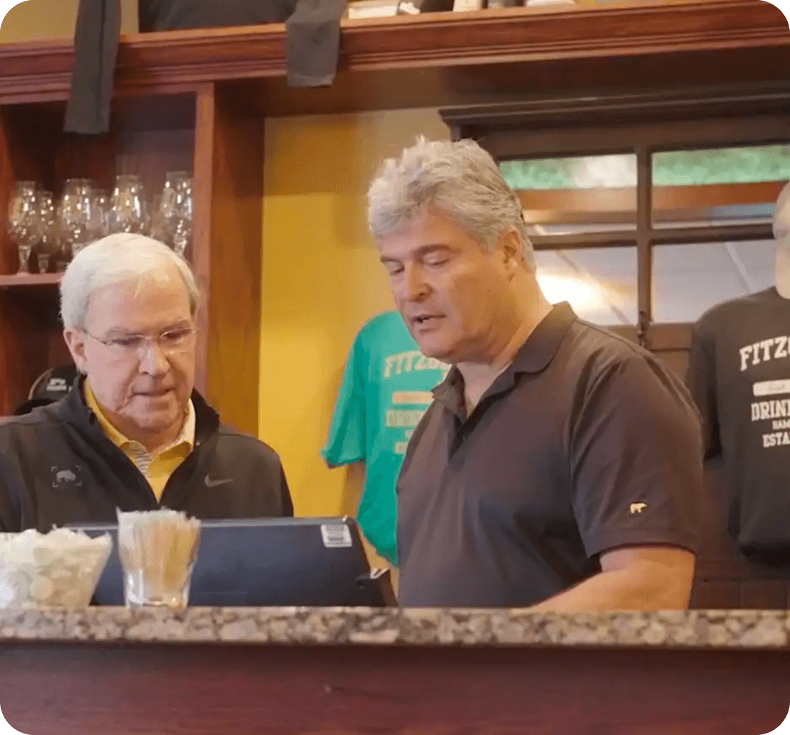 Bob Brunner, Owner of J.P. Fitzgerald’s, and Gary Keilich of Systems Technology Group at the POS counter