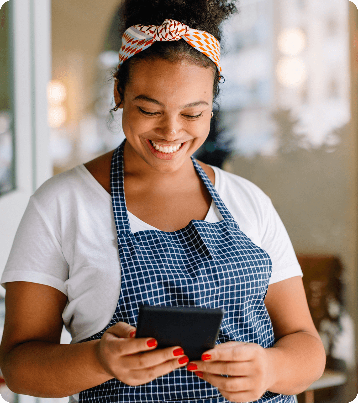 A restaurant owner looks at the restaurant loan repayment details on their phone