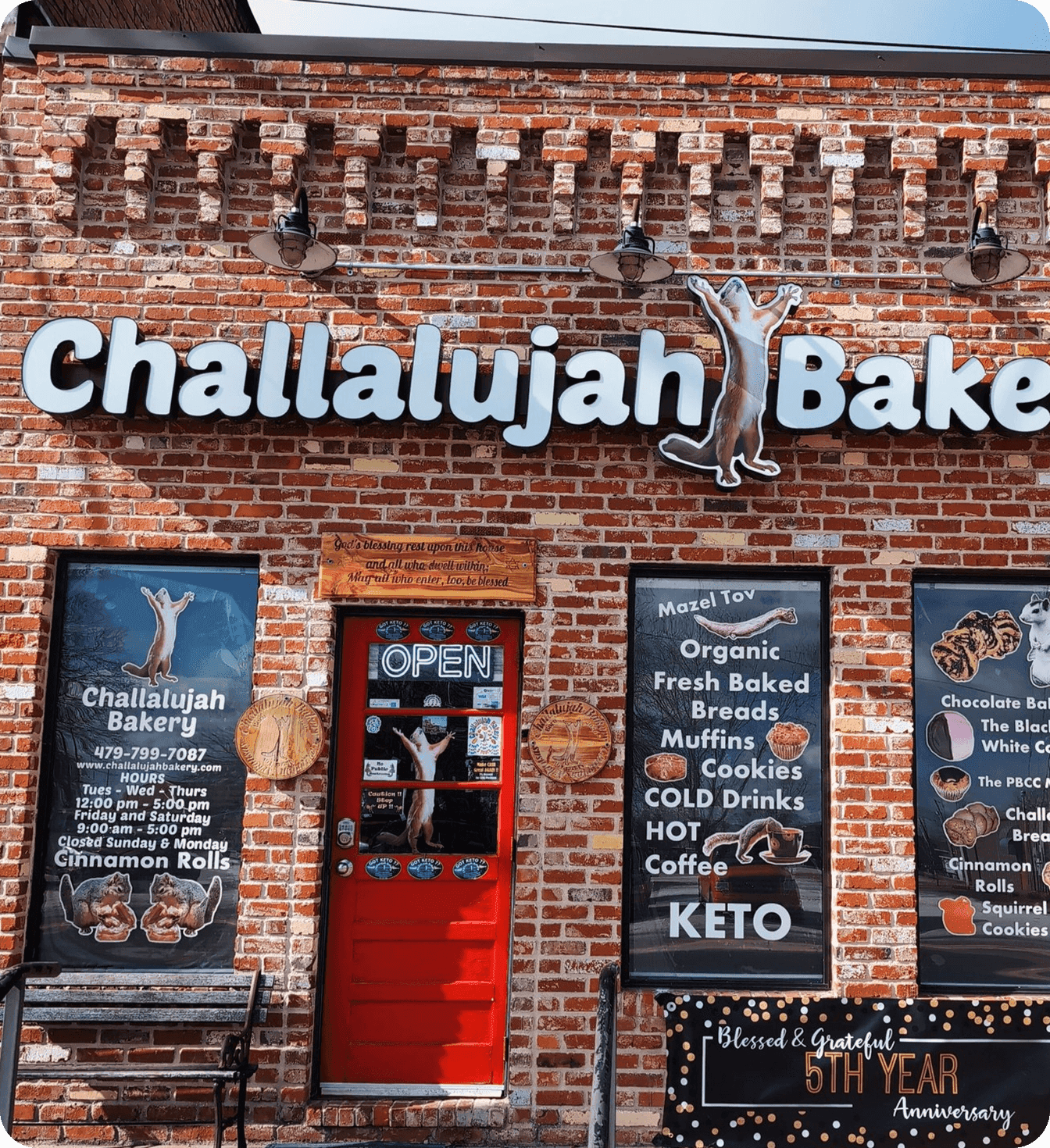 Exterior of Challalujah Bakery with brick facade, signage, and storefront displays