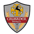 Crusader Brewing Co shield logo with cross emblem, wheat stalks, and stag