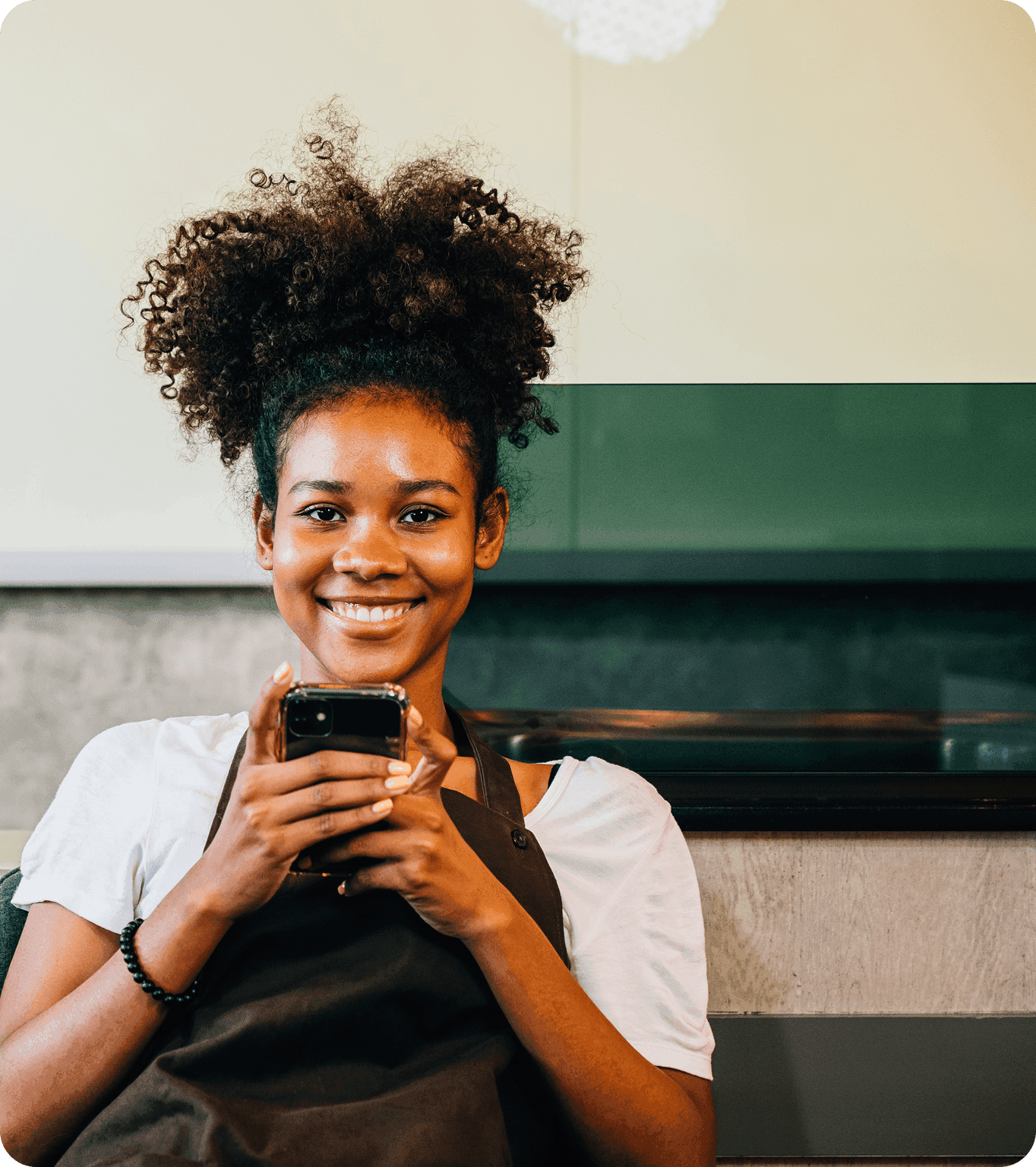 Restaurant employee views the DayCheck earned tip access mobile app
