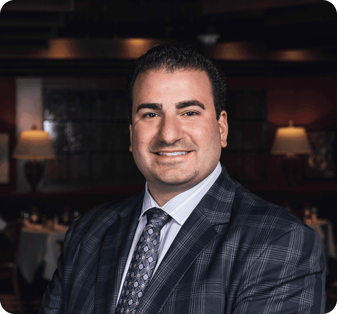Dominic Vicari, Operating Partner of Joe Vicari Restaurant Group, smiling in a professional headshot