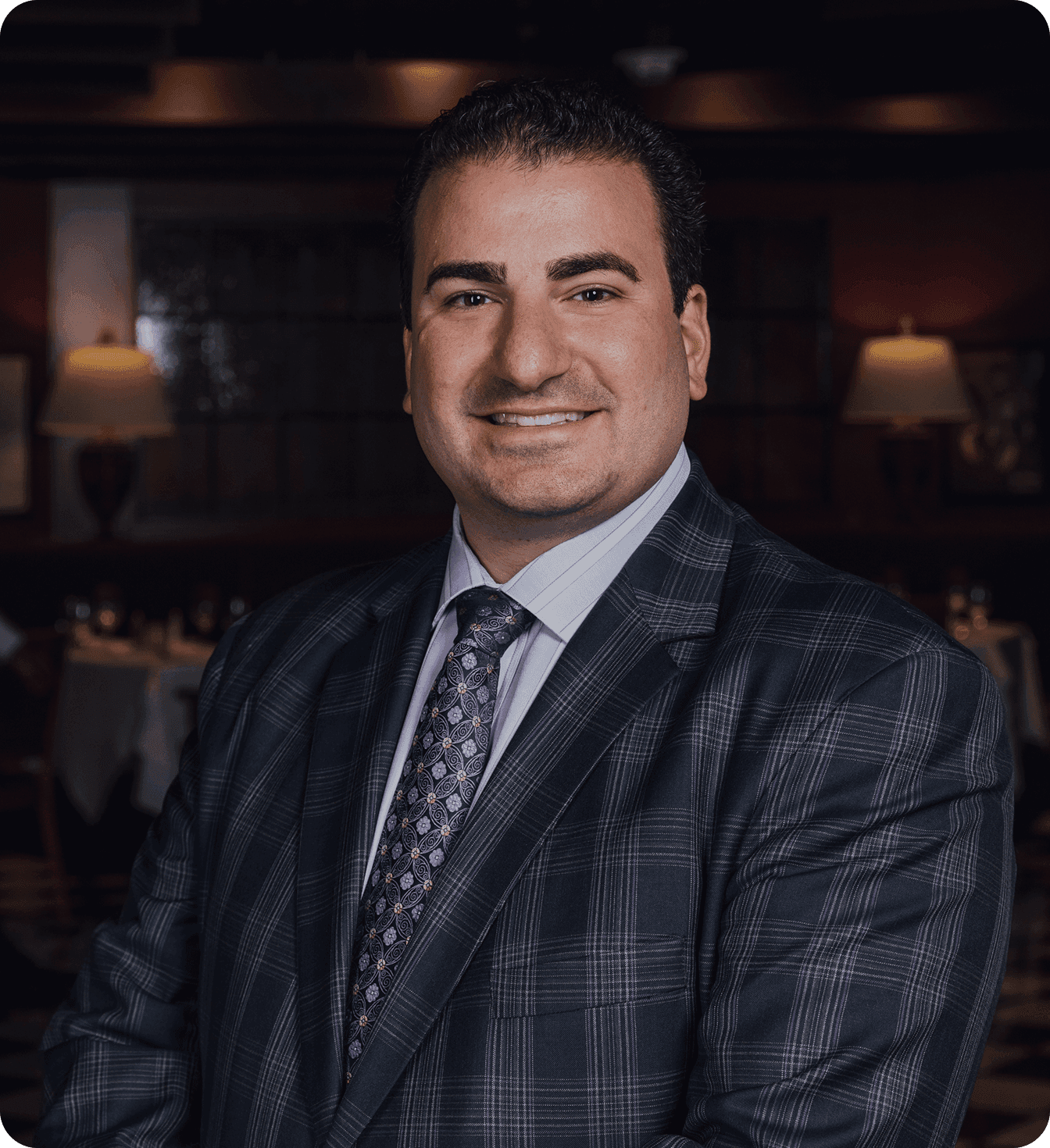 Vicari of Joe Vicari Restaurant Group smiling in a suit