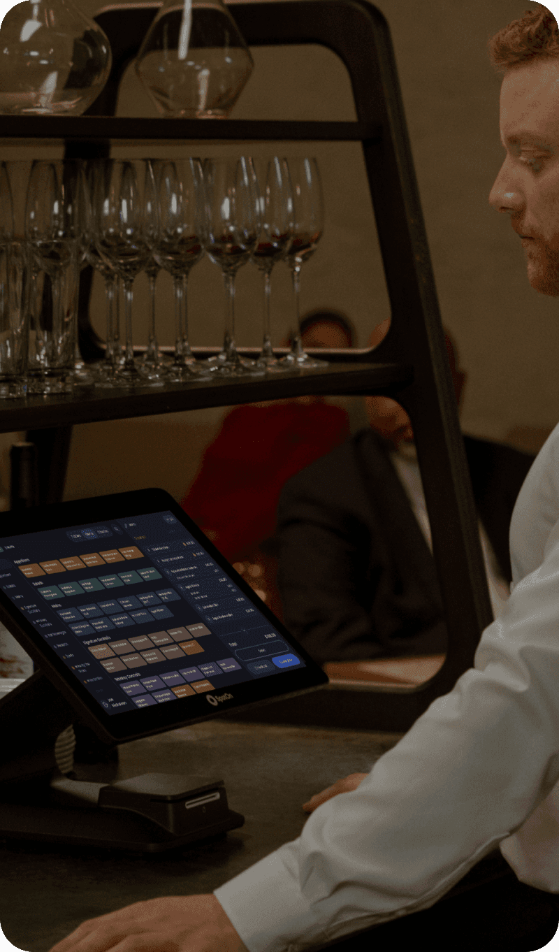 Fine dining server delivering a dish to guests at an elegant table