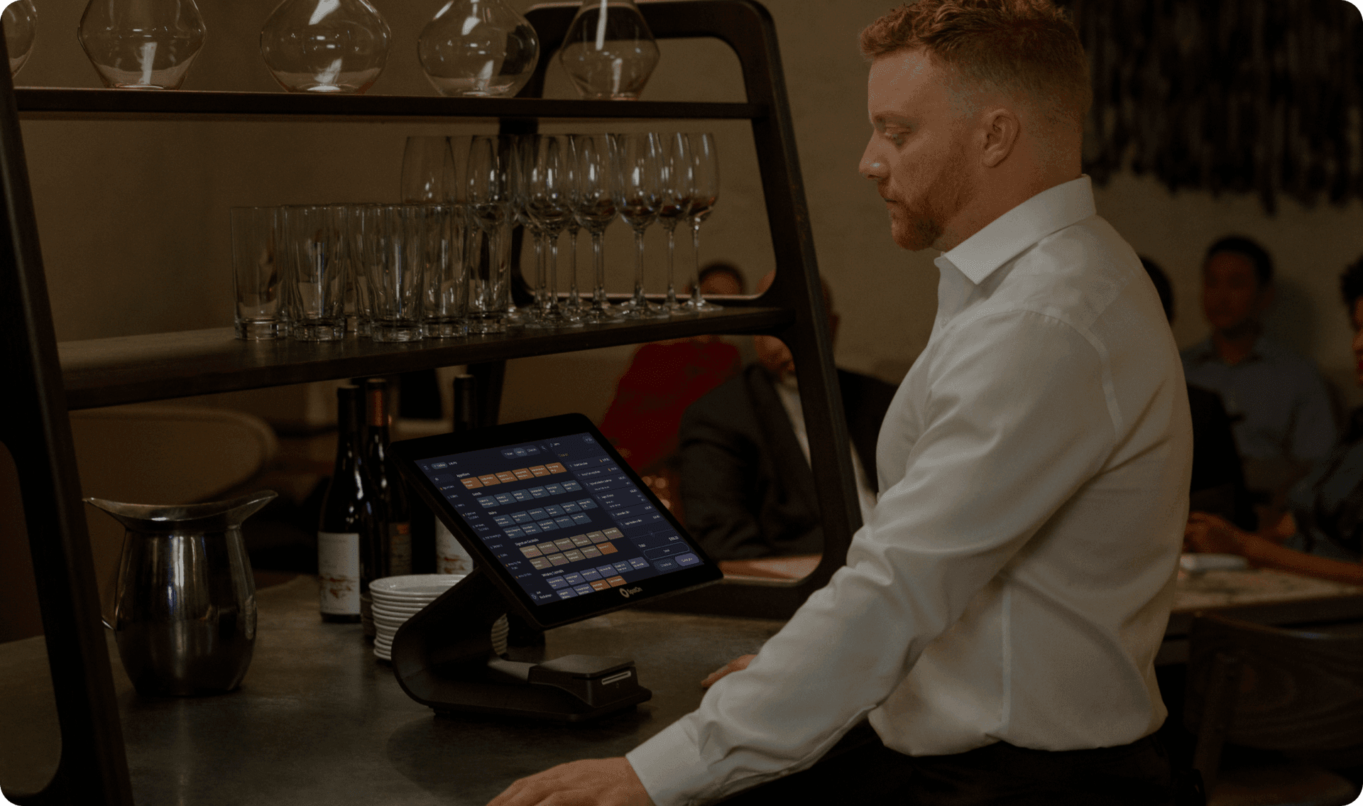 Fine dining server delivering a dish to guests at an elegant table