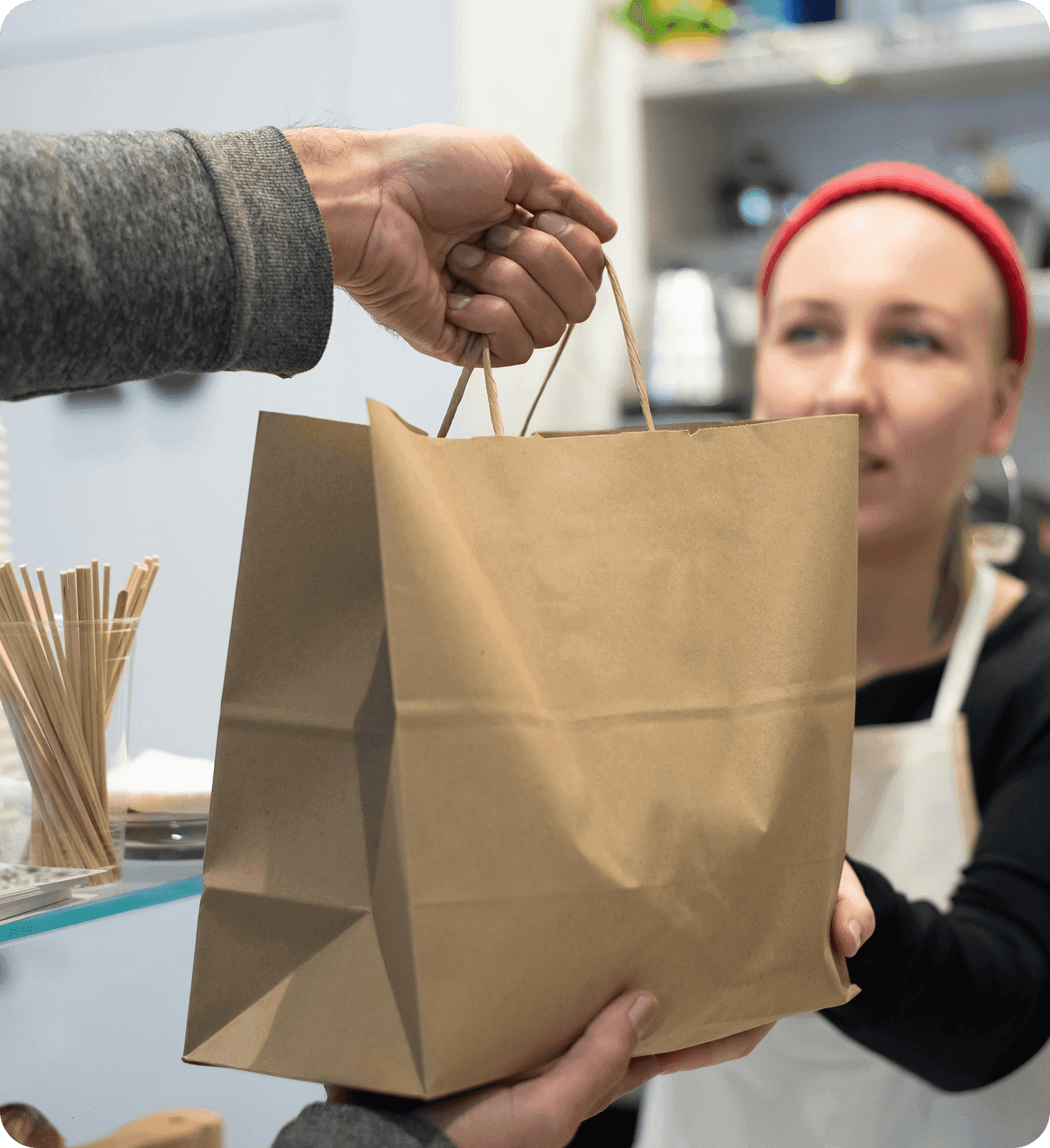 A customer leaves their favorite restaurant with a to-go bag