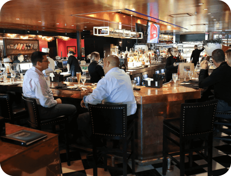 Guests seated at the bar at Joe Muer
