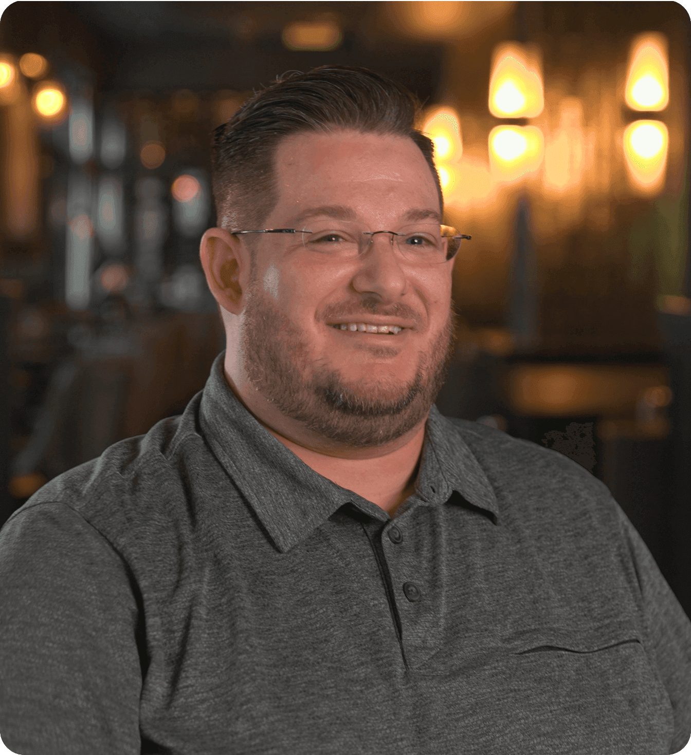 Jonathan Gillespie talking in front of a restaurant dining room