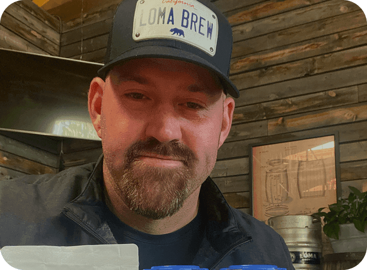 Kevin Youkilis of Loma Brewing Company with craft beer in cans