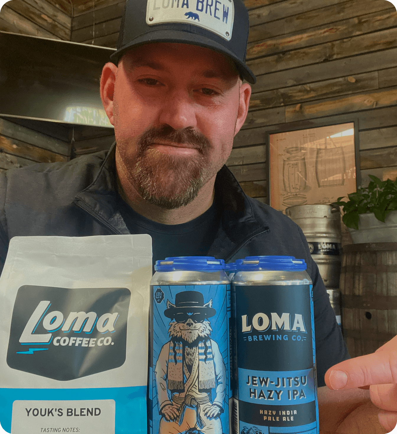 Kevin Youkilis of Loma Brewing Company with craft beer in cans