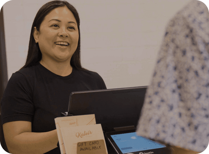 Khara Mangiduyos of Kalei’s Kitchenette helping a customer at the SpotOn POS