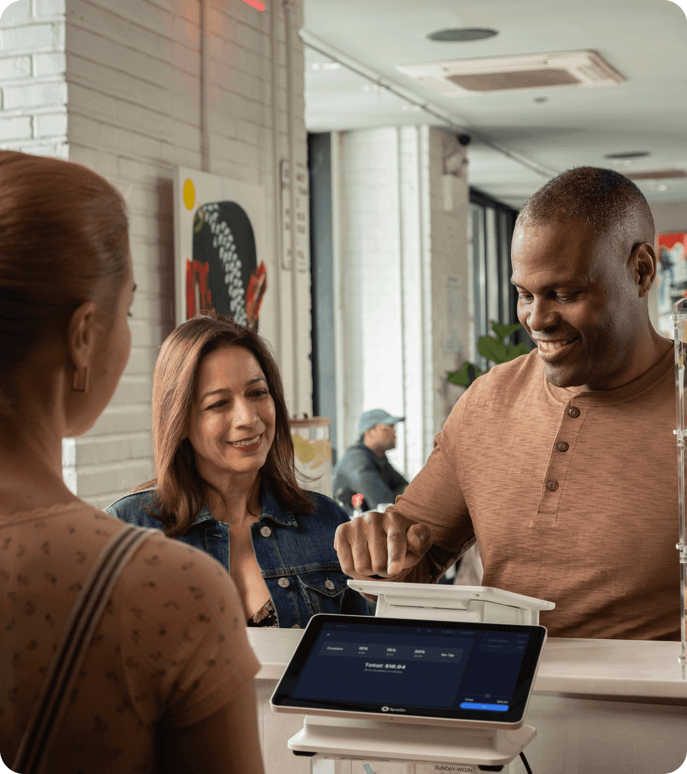 A restaurant manager uses their SpotOn marketing dashboard to update active campaigns.