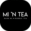 Mi ’N Tea circular black logo with white text for banh mi and bubble tea