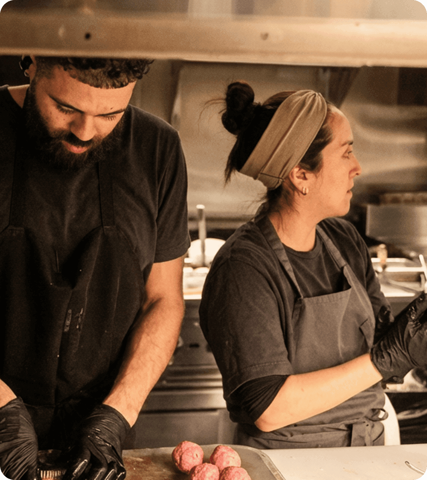 A restaurant employee clocks in using a scheduling app