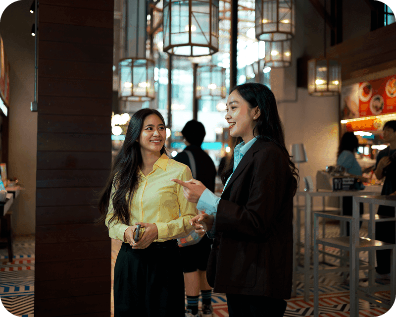 A host seats guests with a reservation at a restaurant