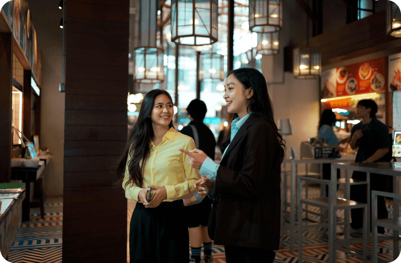 A host seats guests with a reservation at a restaurant