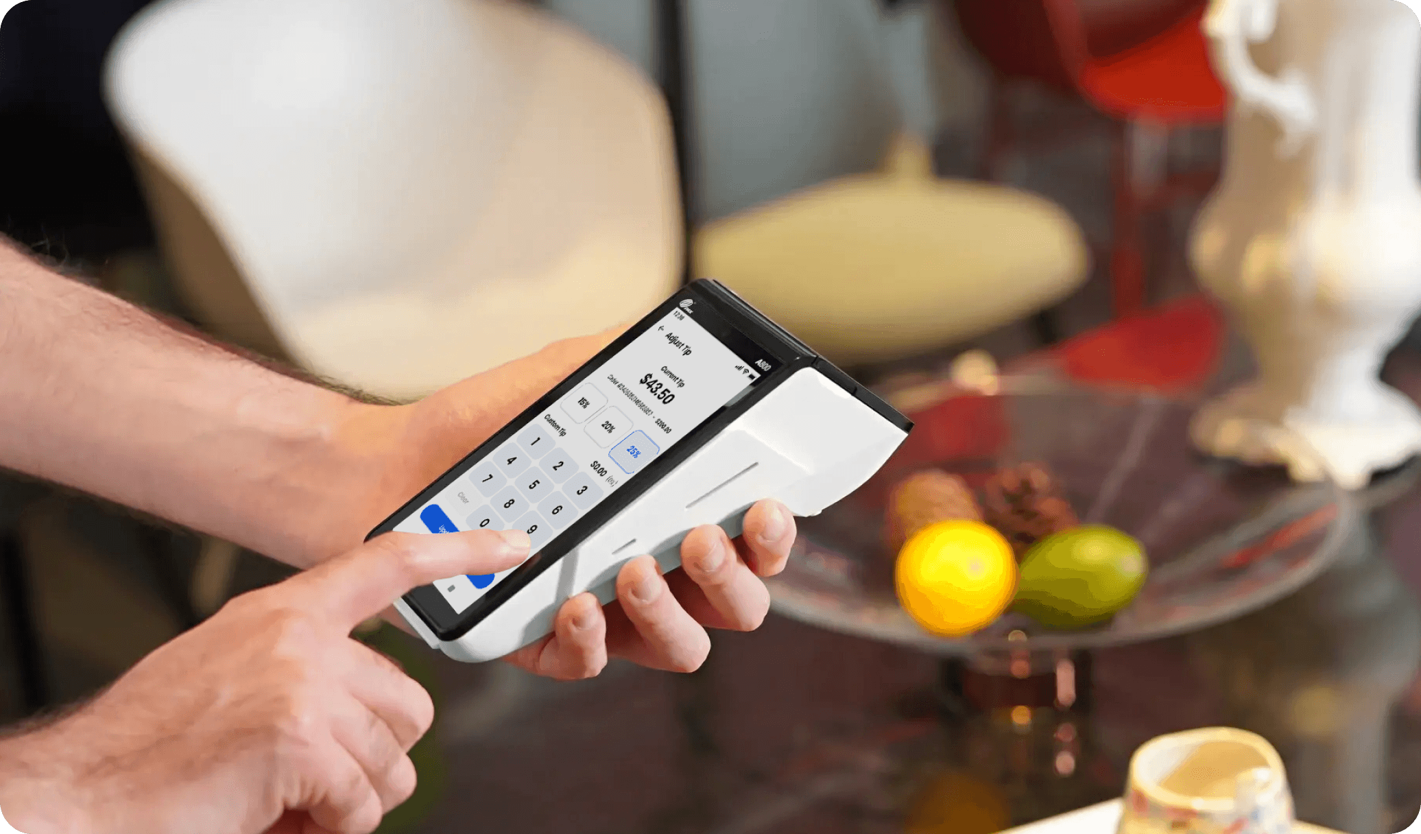 A small business employee runs a payment on a POS terminal