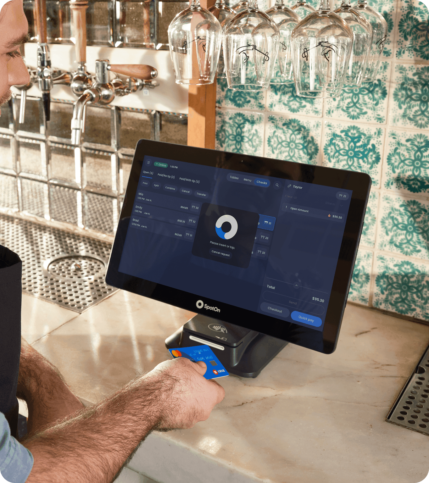 A restaurant customer pays for their bill