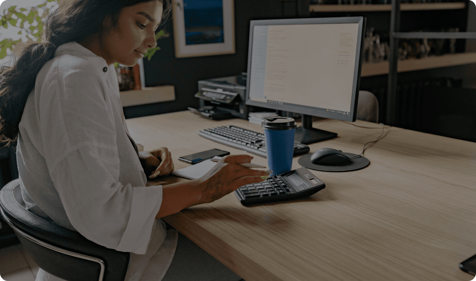 A professional business owner prepares a payment for a client