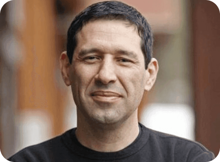 Ray Villaman, Owner of Base Camp Pizza, smiling in a professional headshot