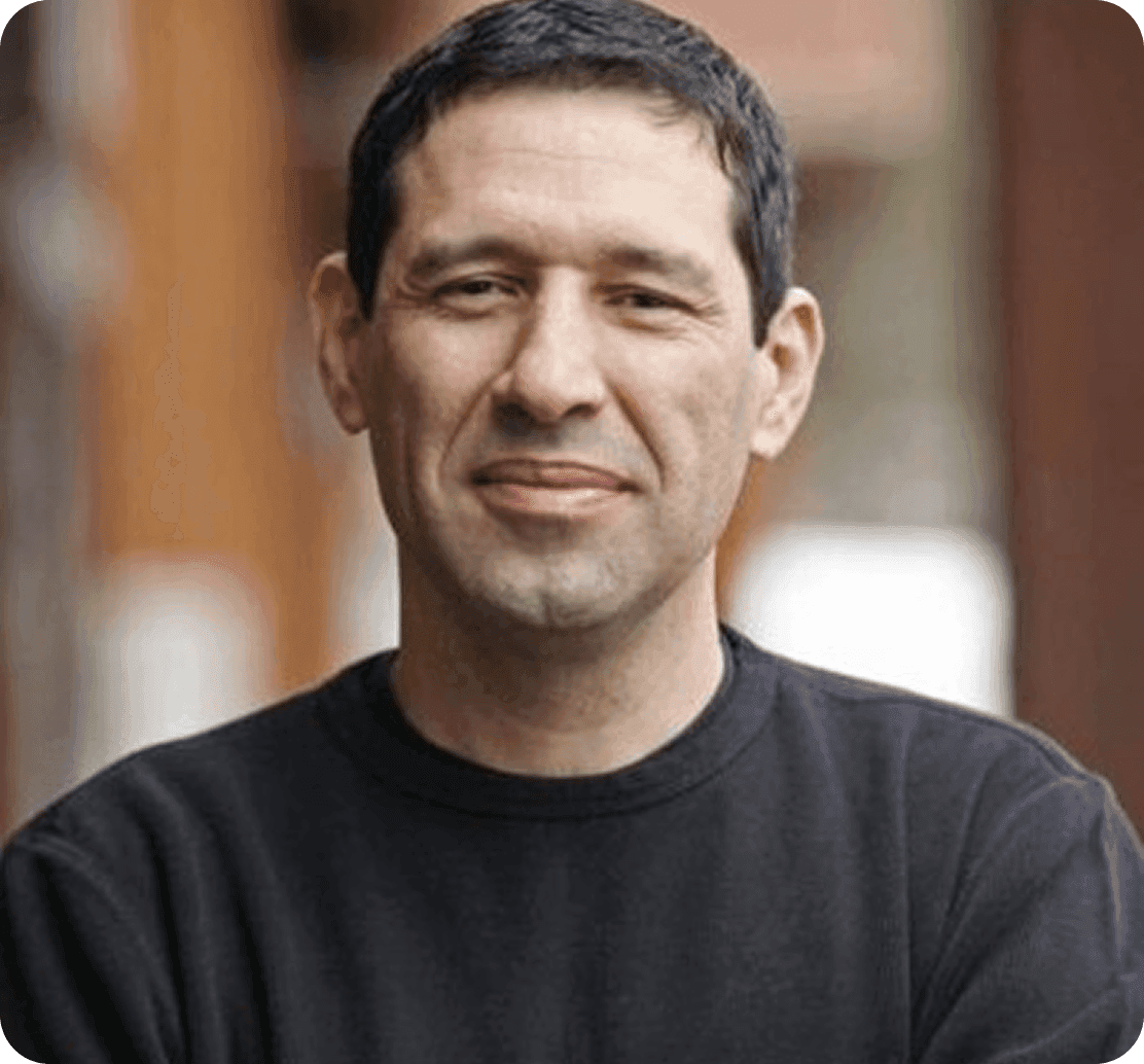 Ray Villaman, Owner of Base Camp Pizza, smiling in a professional headshot