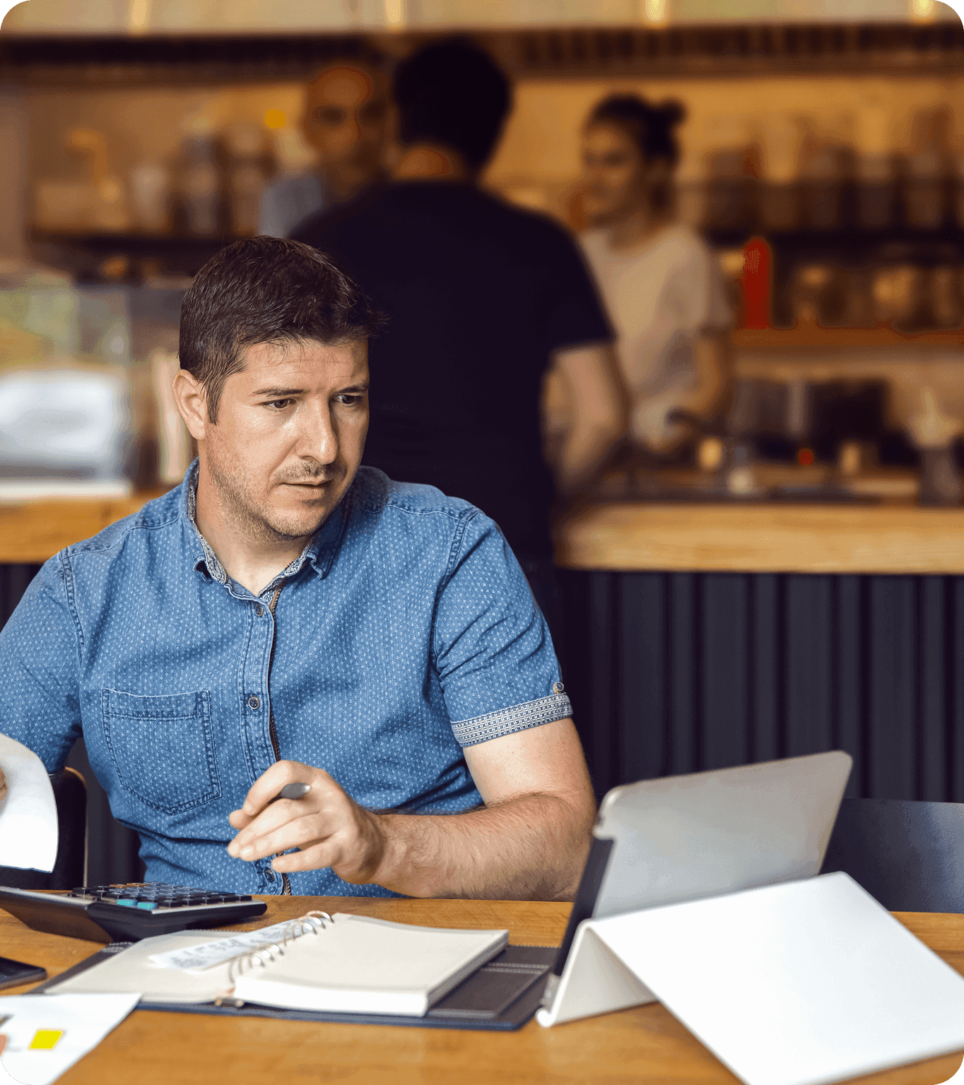 A restaurant bookkeeper reviews tips while running payroll