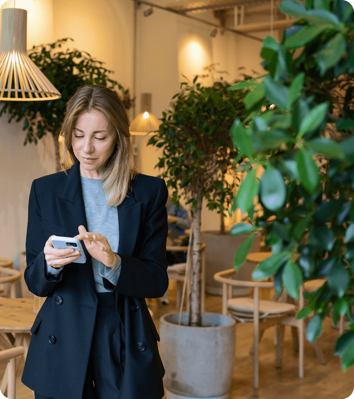 Restaurant manager looking at labor projections on their mobile phone