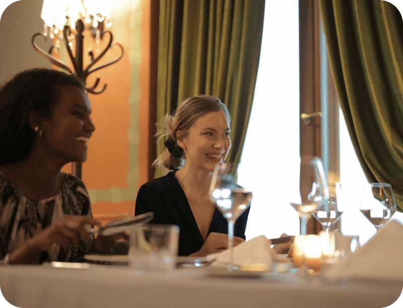 A chef talks to a group of diners attending a special restaurant event