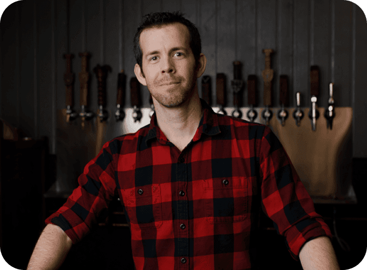 Richard Mcenulty, Managing Partner of Crusader Brewing Company, behind the bar