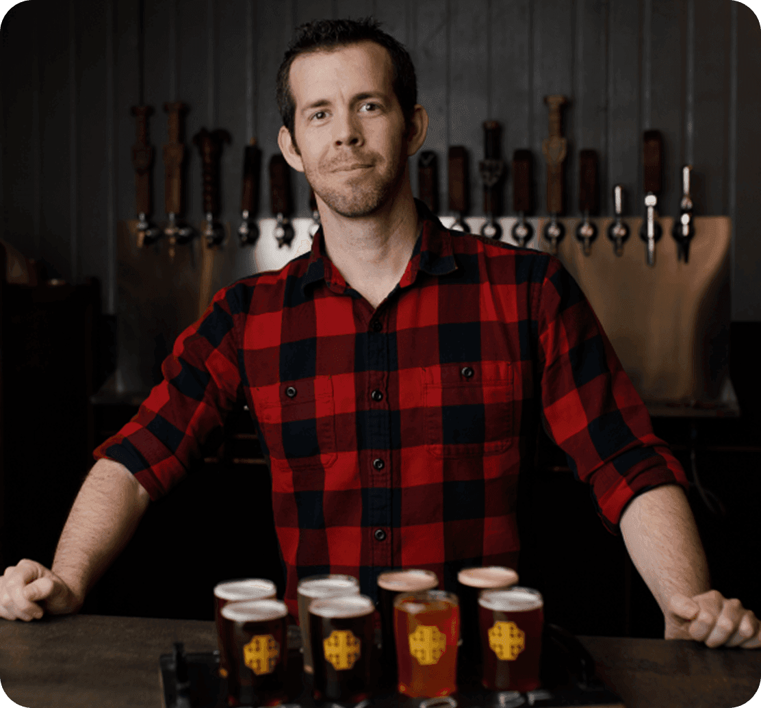 Richard Mcenulty, Managing Partner of Crusader Brewing Company, behind the bar