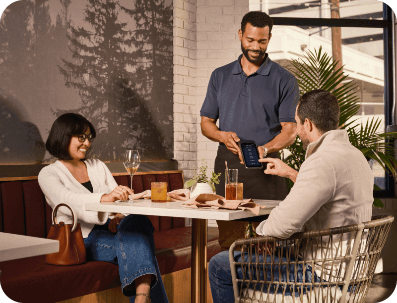 Restaurant servers interacting with guests before getting tipped