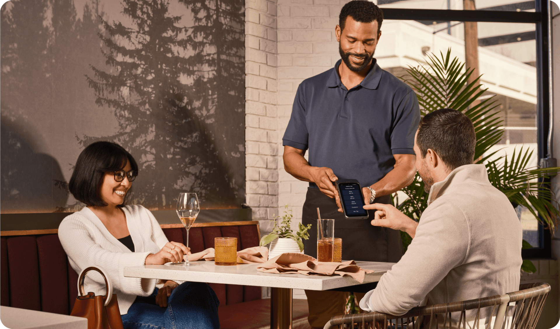 Restaurant servers interacting with guests before getting tipped