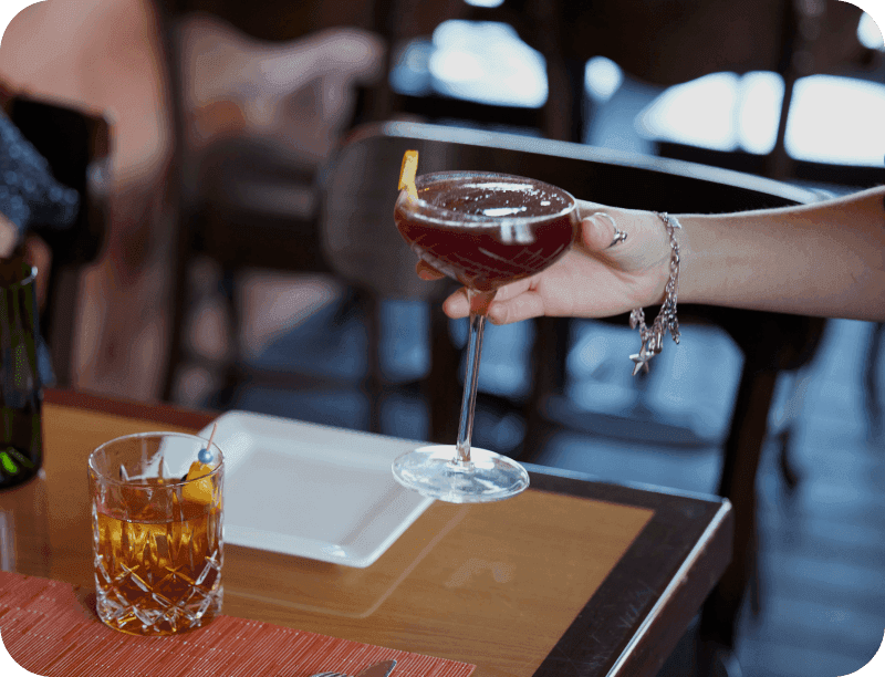 Drinks being served to a table a Shep's Bar & Grill