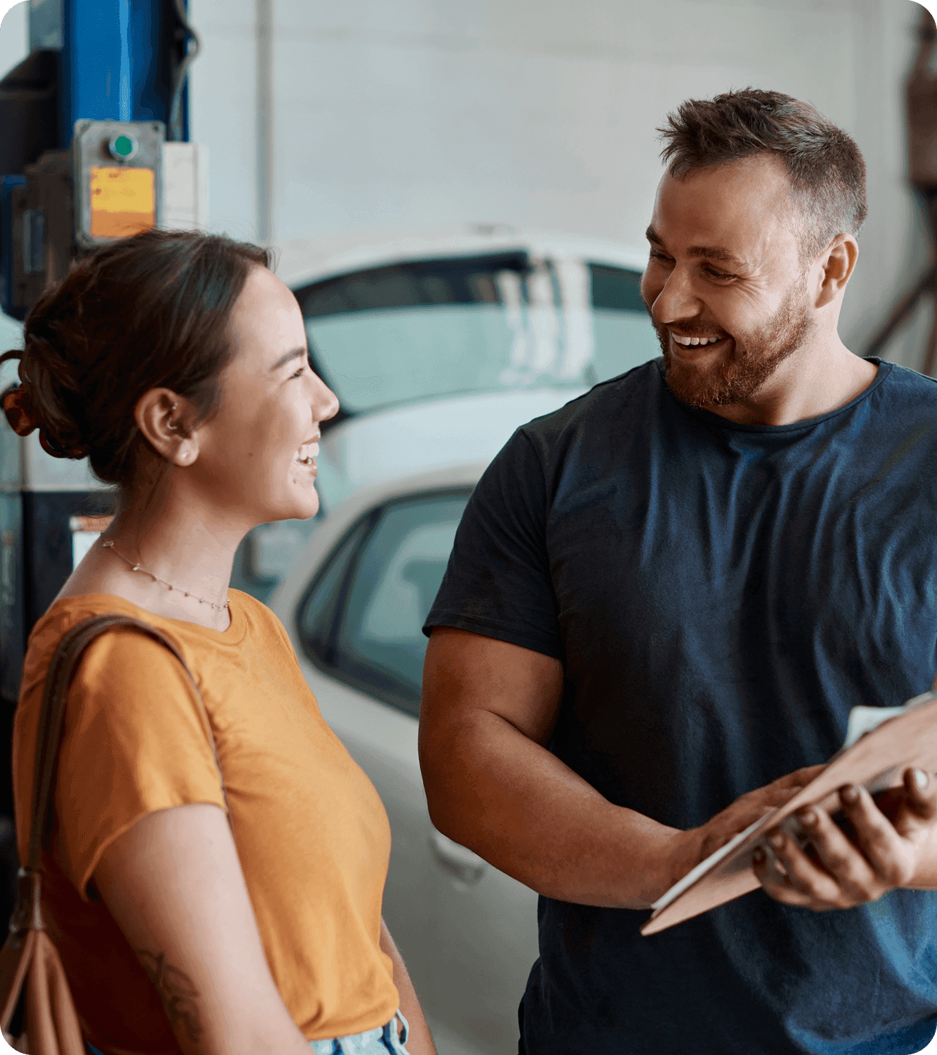 A customer talks to the cashier at a small business and signs up for the loyalty program