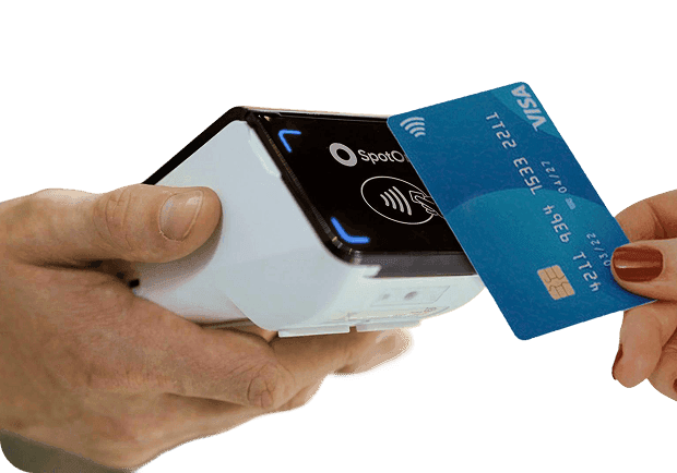 A customer taps to pay with a credit card on a small business POS terminal