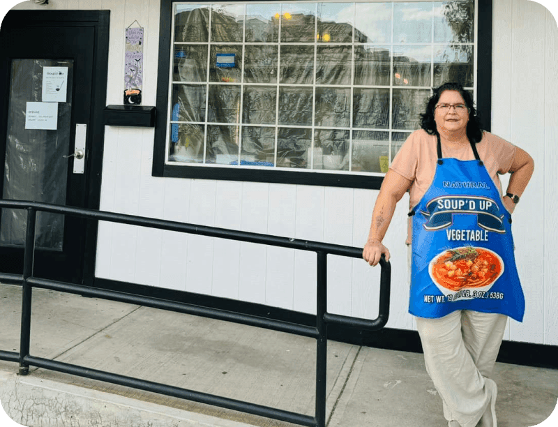 Renee Gordon, Chef & Owner of Soup’d Up, standing outside the restaurant’s storefront