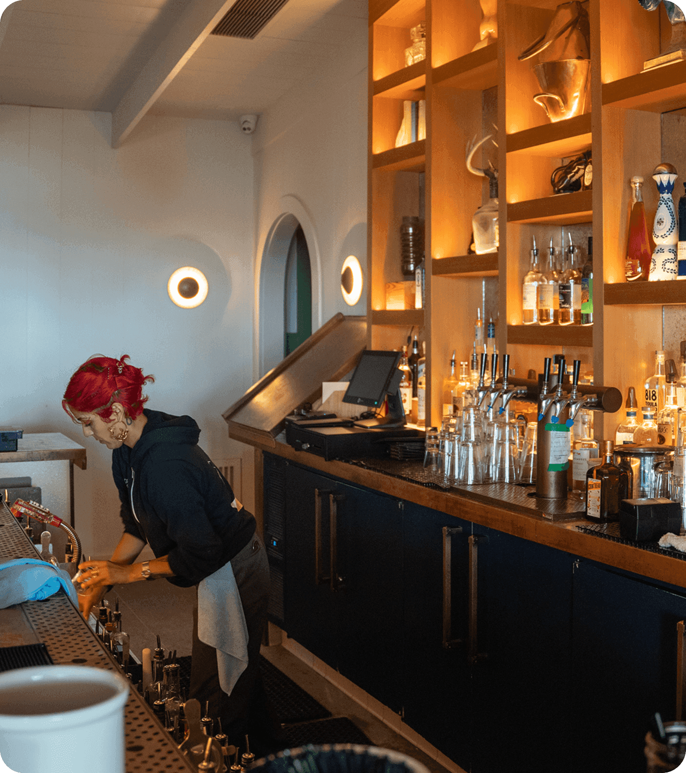 A restaurant employee leaves work and transfers their earned tips to the SpotOn Card