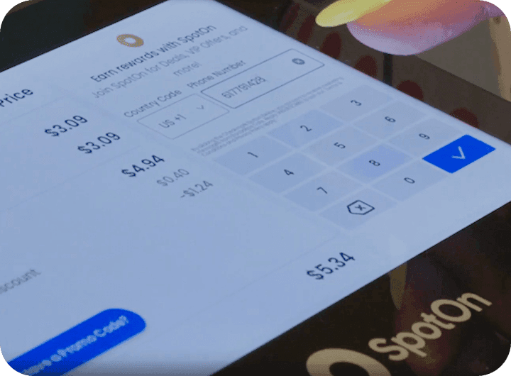 Customer using SpotOn Loyalty on a guest facing display at Bocaditos Cafe