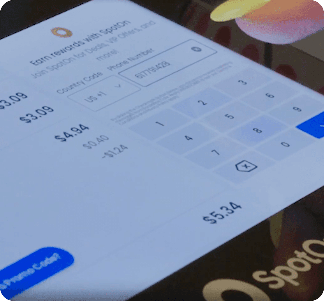 Customer using SpotOn Loyalty on a guest facing display at Bocaditos Cafe