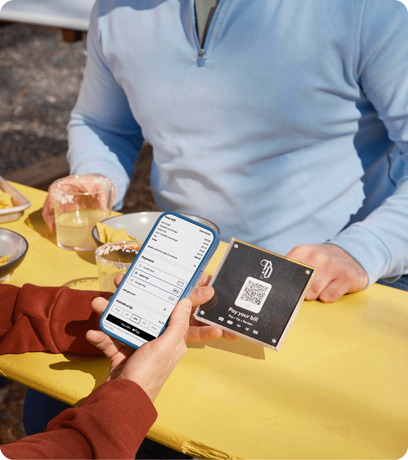 Guest at restaurant ordering from QR codes