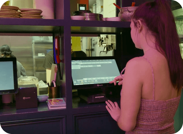 A server using SpotOn RPOS at Talat Market