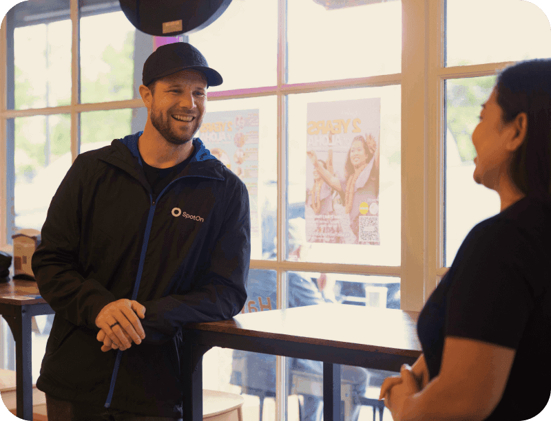 SpotOn representative training restaurant staff on the POS system