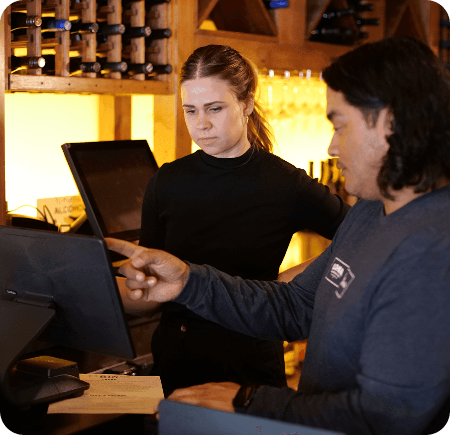 SpotOn representative training restaurant staff on the POS system
