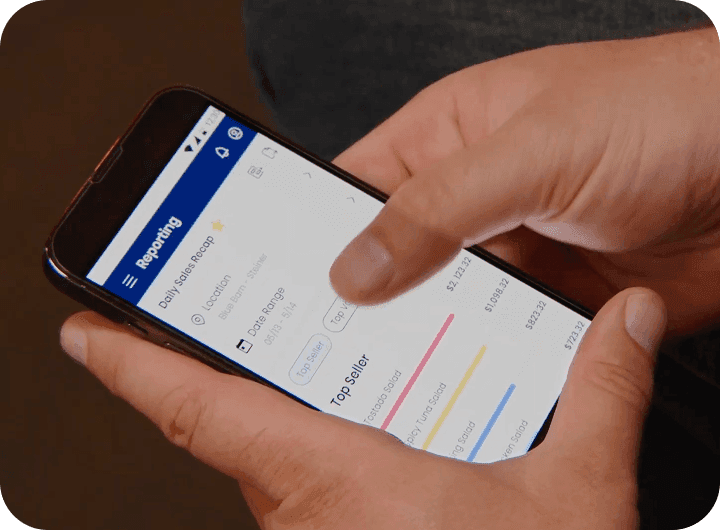 Checking daily sales in the SpotOn Reporting app on a phone at Blue Barn