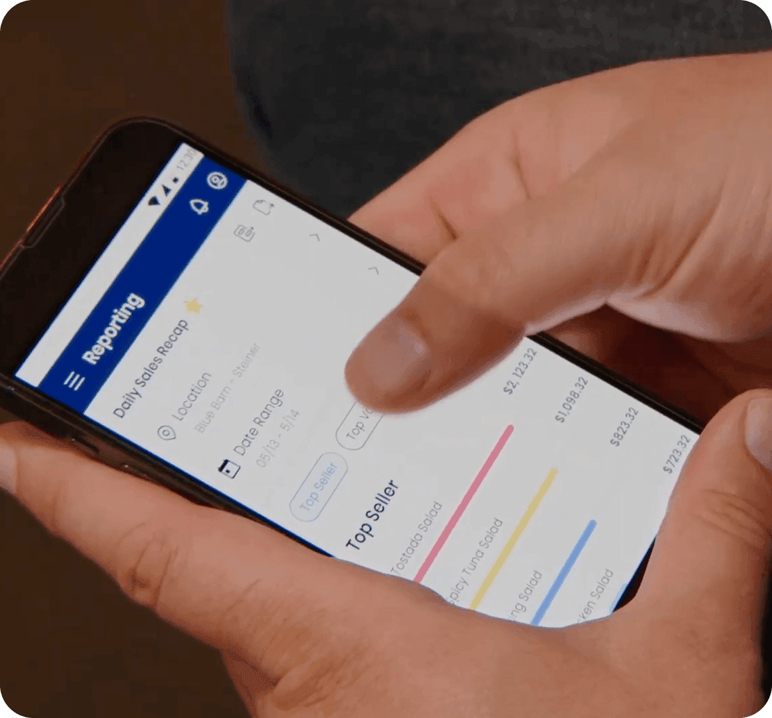 Checking daily sales in the SpotOn Reporting app on a phone at Blue Barn